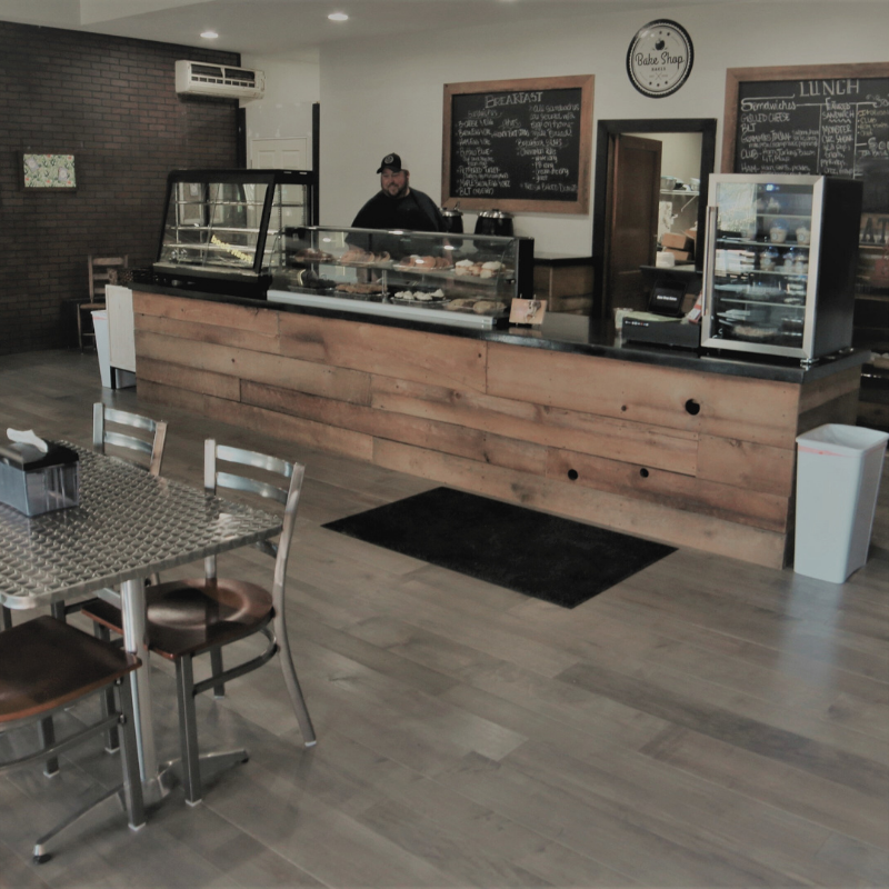 Real Solid Wood Floor floating over concrete in light restaurant applications - includes instant repairs