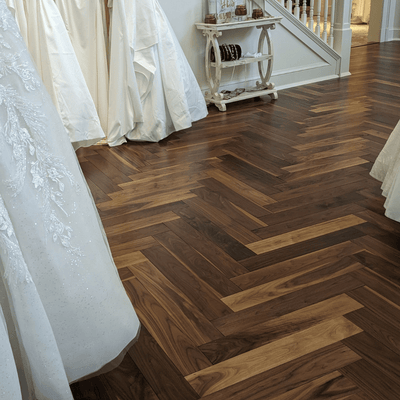 Luxury Retail by Steller Floors in Solid Walnut Herringbone