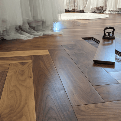 Luxury Retail by Steller Floors in Solid Walnut Herringbone