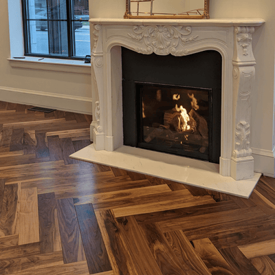 Luxury Retail by Steller Floors in Solid Walnut Herringbone- Fireplace treatment
