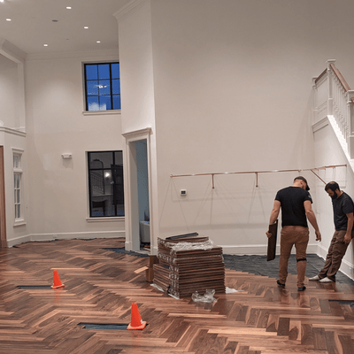 Luxury Retail by Steller Floors in Solid Walnut Herringbone- Two Day Install