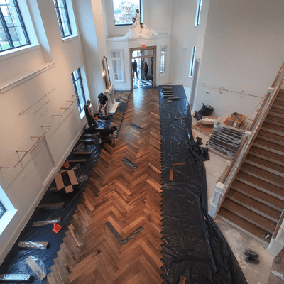 Luxury Retail by Steller Floors in Solid Walnut Herringbone- Two Day Install