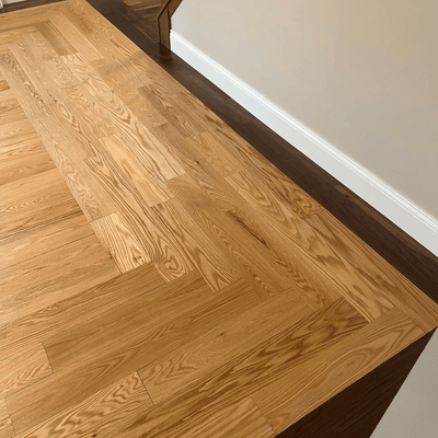 Steller Floating Solid Wood Floors in DIY Renovations - Tahoe Walnut Picture Frame Border with American Oak Tacoma - Craftsmanship - Laced Corner
